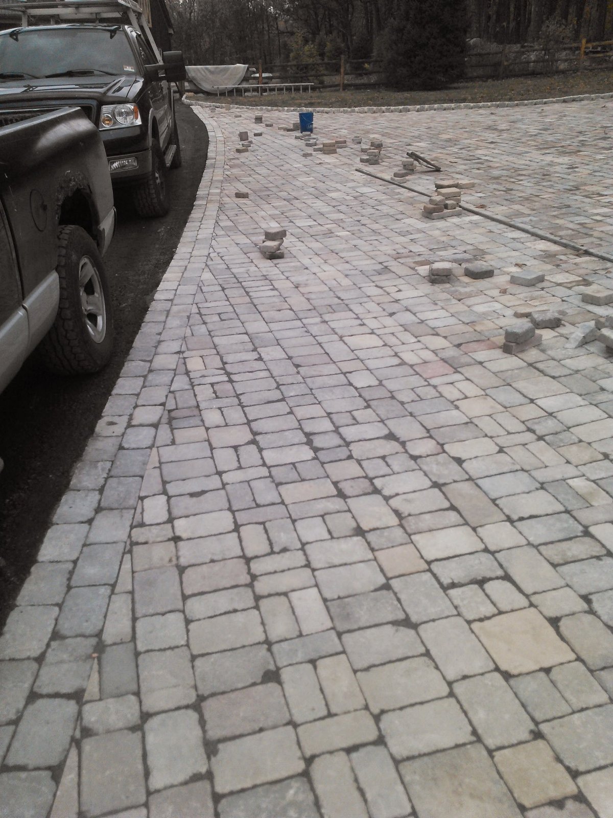 Dark SUV parked on paved driveway